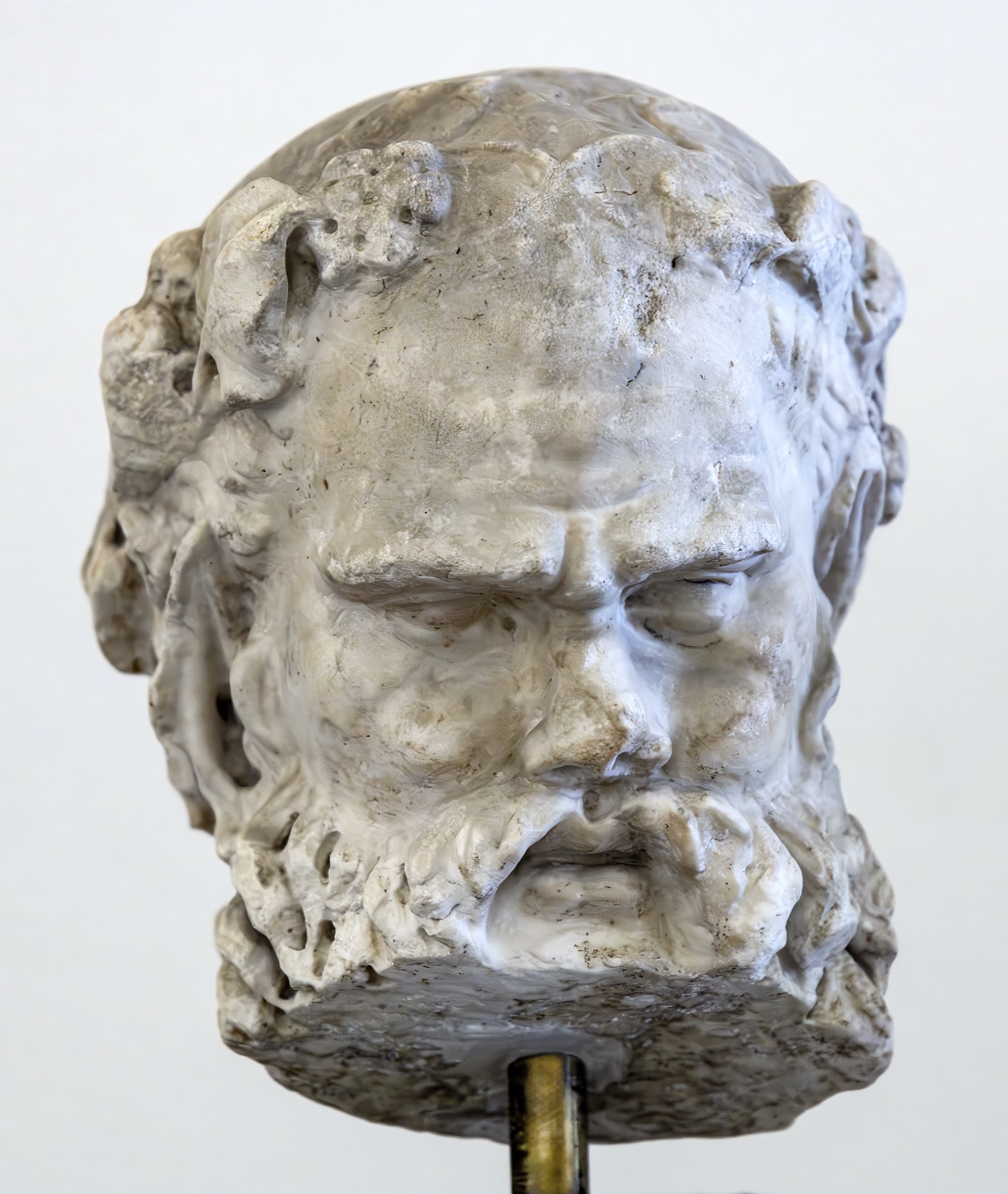 A weathered marble head of Silenus